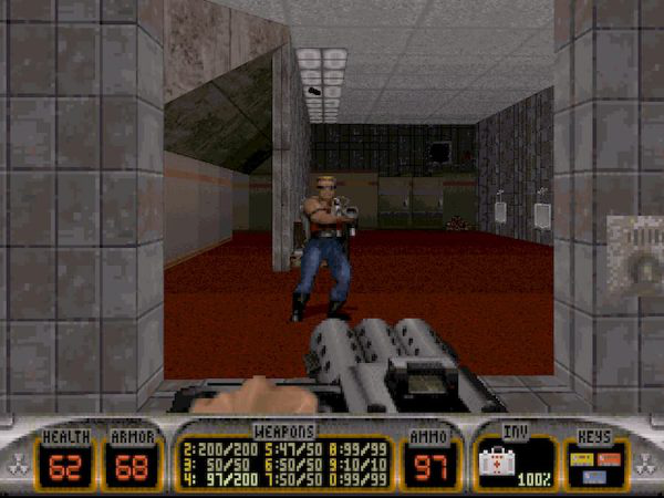 Screenshot of Duke Nuke'em 3D of the player looking into a mirror, seeing Duke looking back.